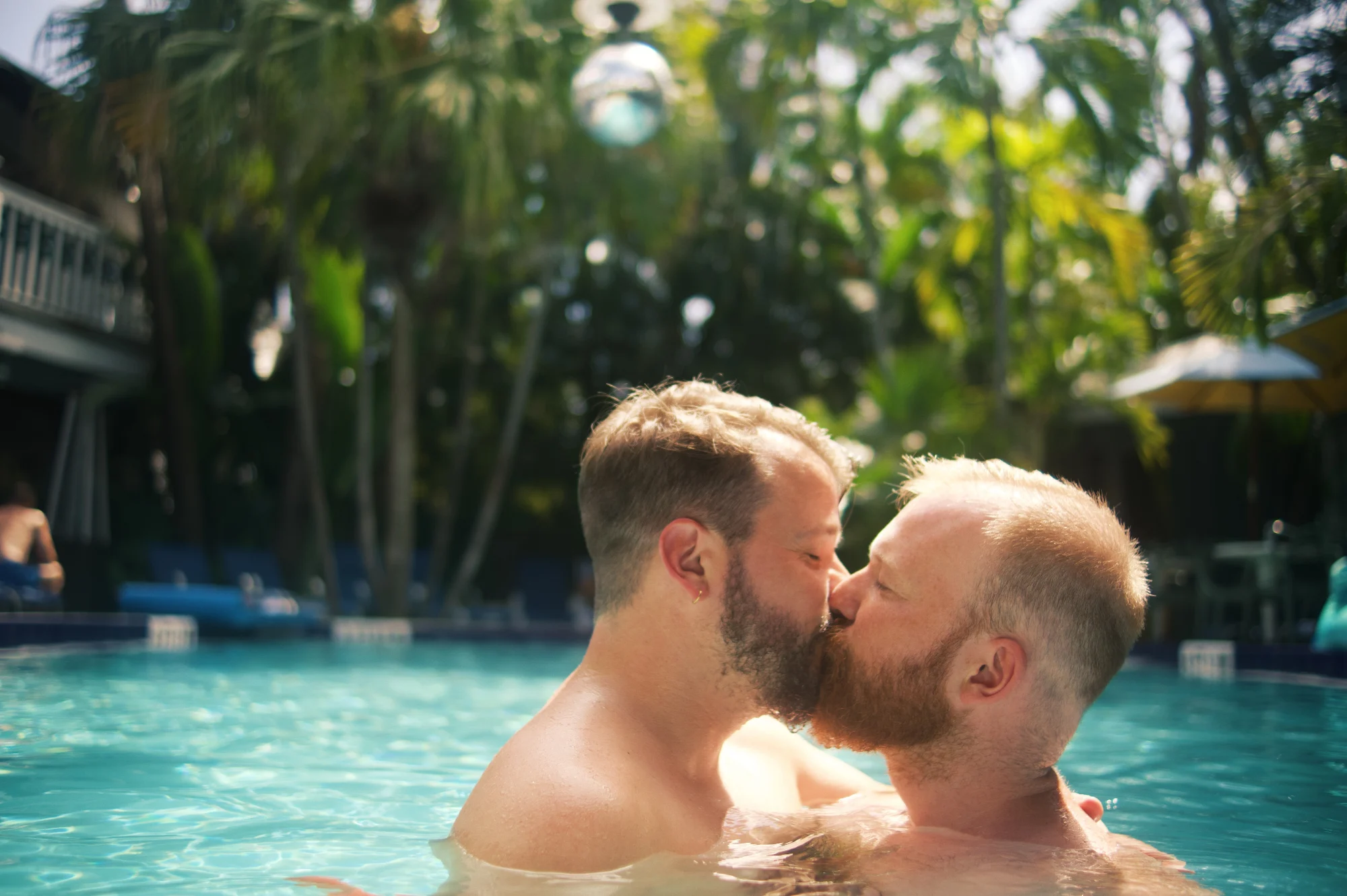 Karl and Daan a gay kiss in the pool of the Island House in Key West -best gay resort in the world © Coupleofmen.com