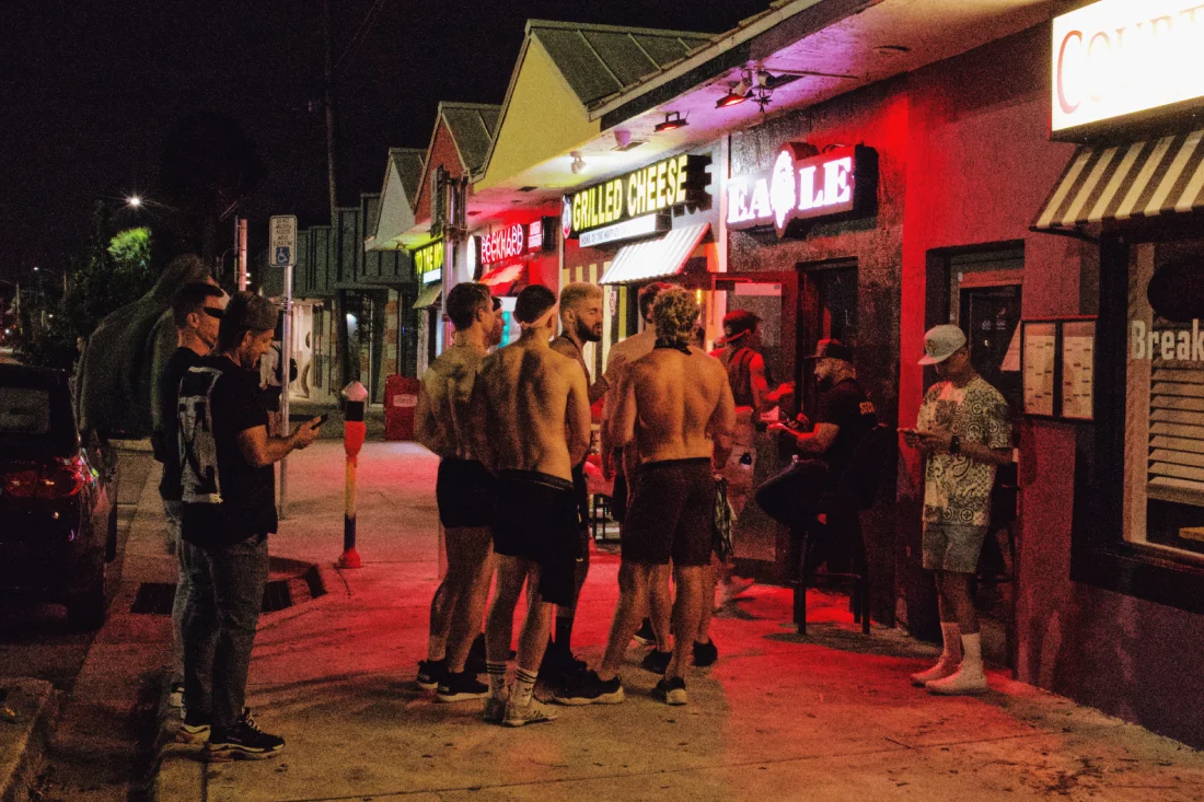 A group of guys waiting in front of the Eagle in Wilton Manors © Coupleofmen.com