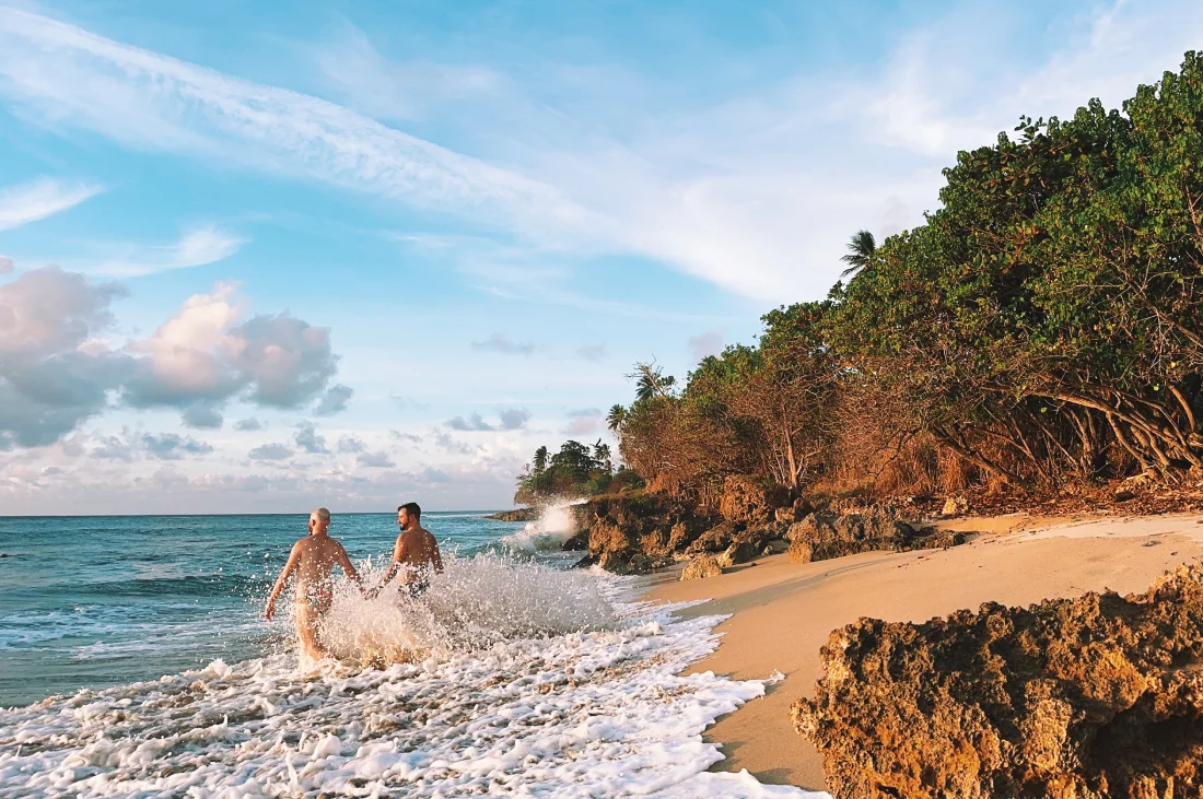 Caribbean Island Puerto Rico hand in hand at the beach © Coupleofmen.com