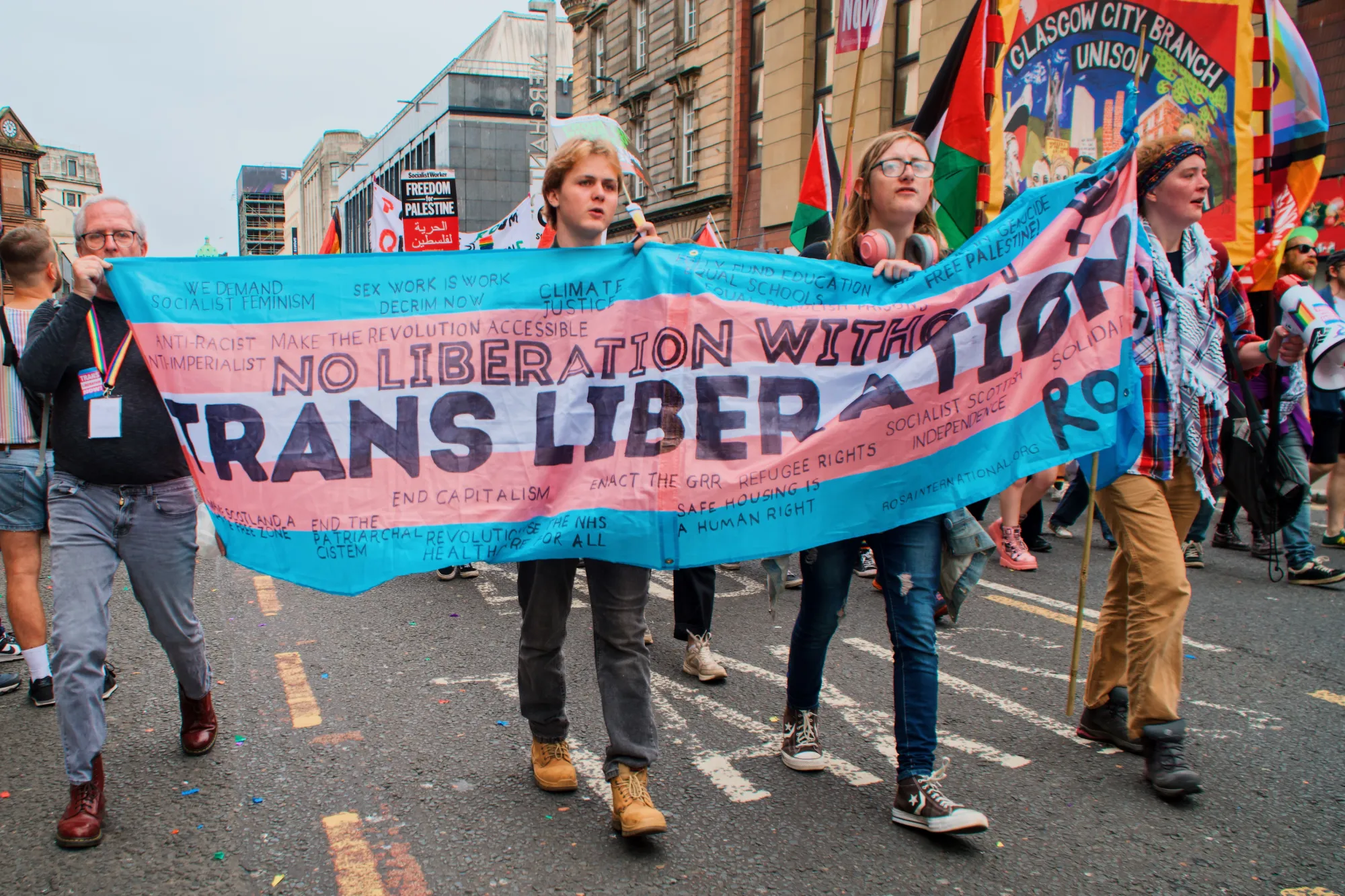 "No liberation without Trans Liberation" banner during Glasgow Pride 2024 © Coupleofmen.com