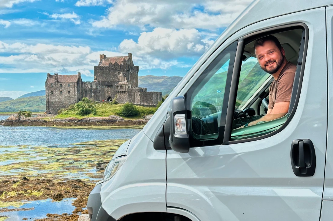 Road Trip Scottish Highlands Happy Karl! Parking spot with a view of Eilean Donan Castle © Coupleofmen.com 