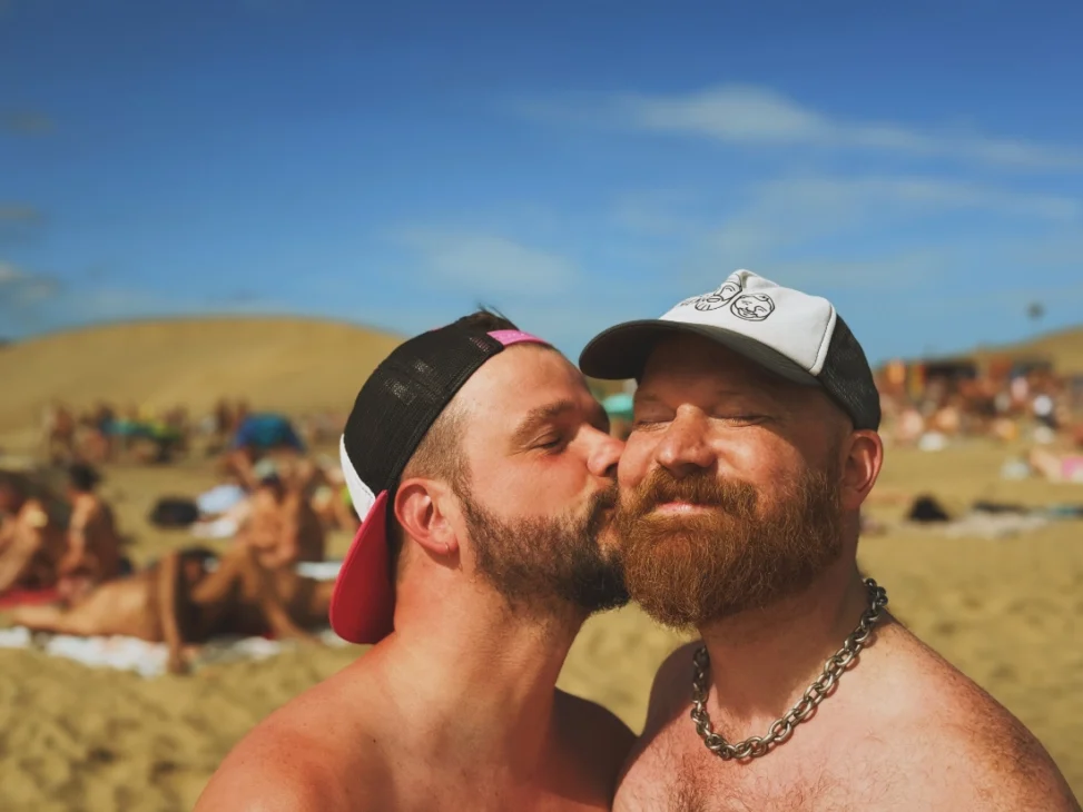 Karl kissing Daan at the Maspalomas Gay Beach while wearing caps and nothing else Gay beaches in Europe