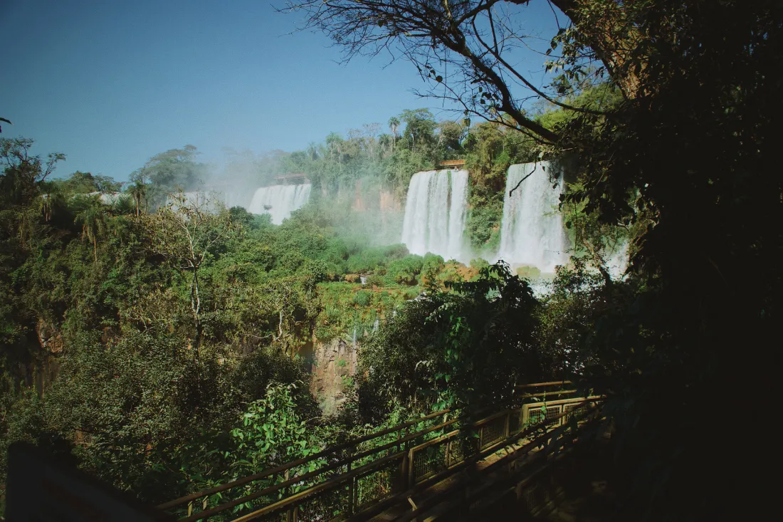Hiking trail on wooden boardwalks and secured pathways at Iguazu Falls in Argentina with a Couple of Men © Coupleofmen.com