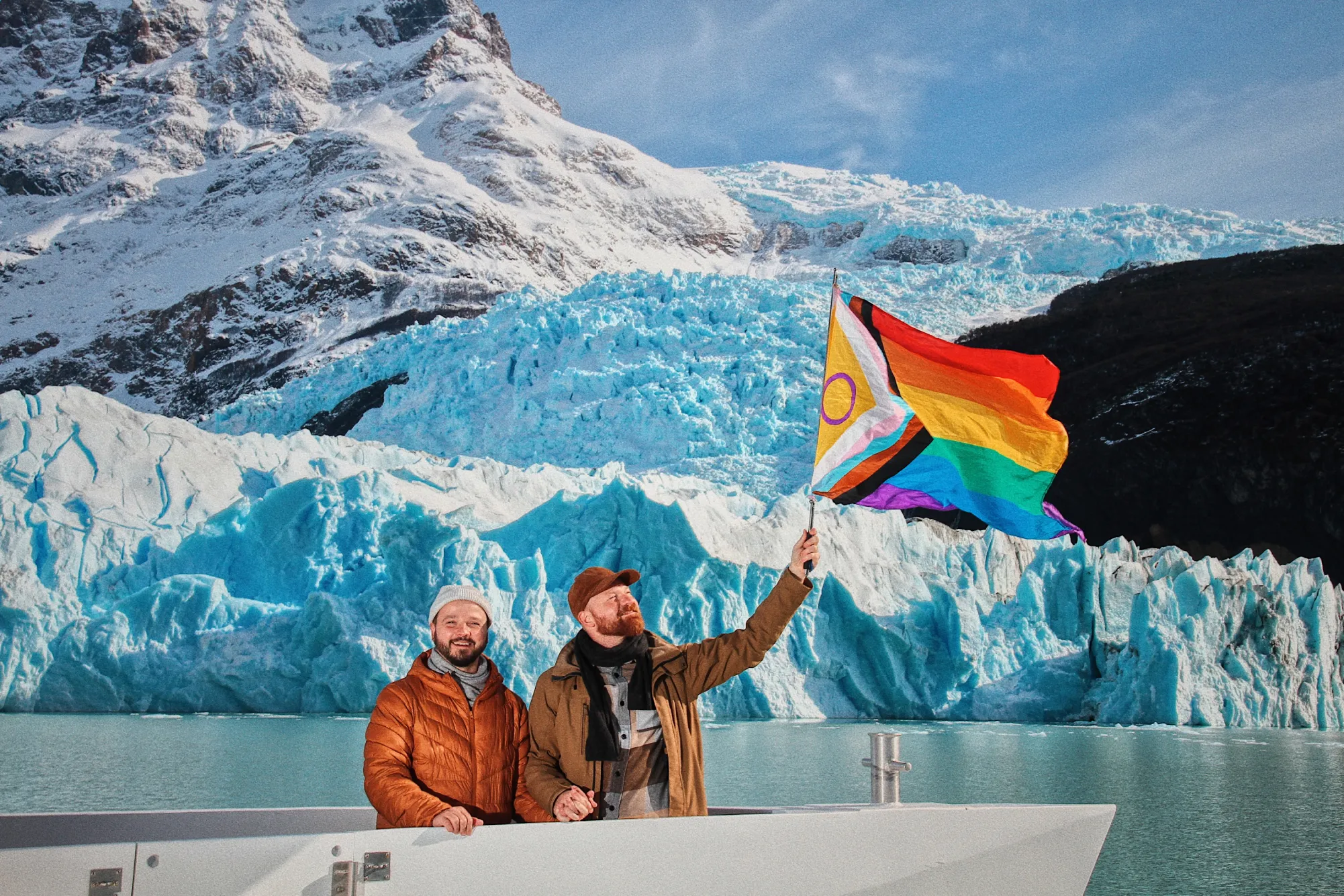 Waving the progress flag in front of Spegazzini Glacier in Argentina © Coupleofmen.com El Calafate gay travel