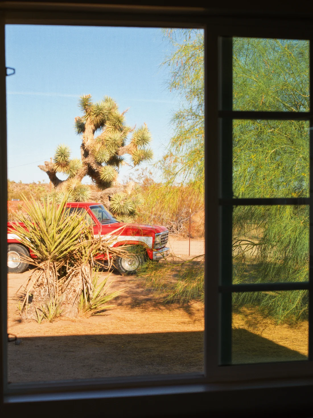 View out of the living room window on the red Ford © Coupleofmen.com