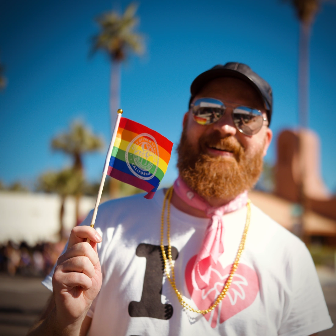 Daan waving a little Palm Springs Pride Flag © Coupleofmen.com