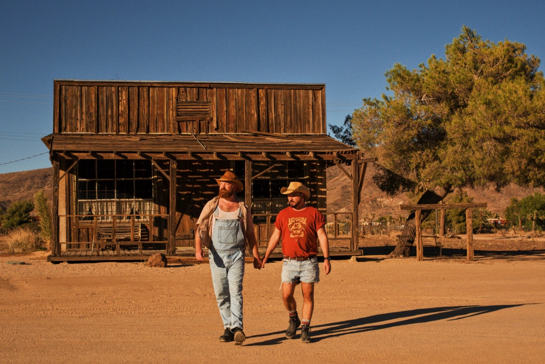 Exploring Pioneertown in California hand in hand as gay couple travelers © Coupleofmen.com