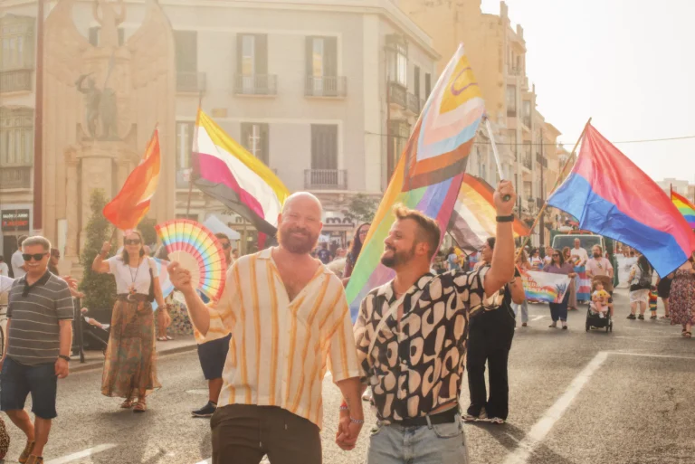 Couple of Men walking the Pride in Melilla hand in hand together &copy; Coupleofmen.com