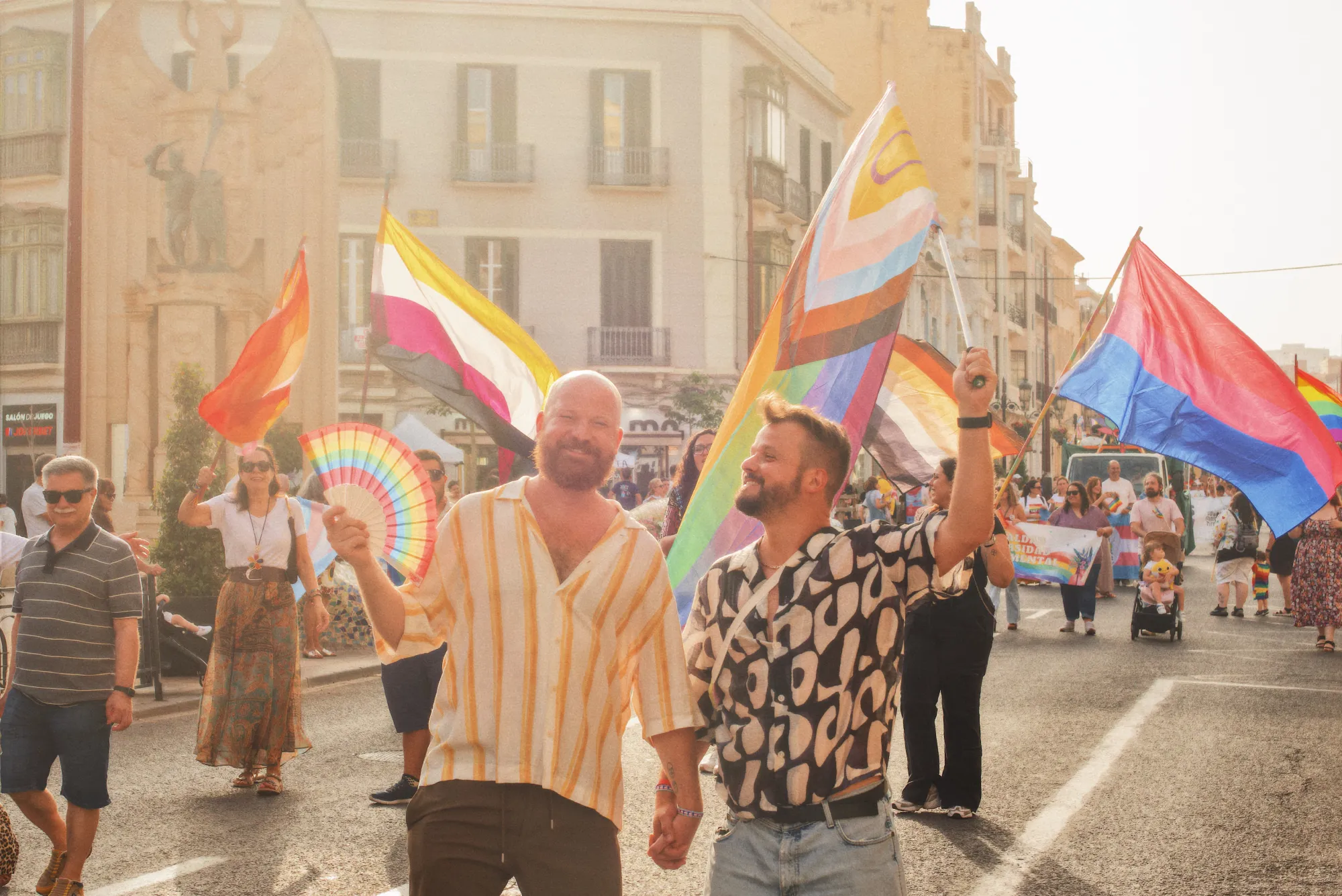 Couple of Men walking the Pride in Melilla hand in hand together © Coupleofmen.com