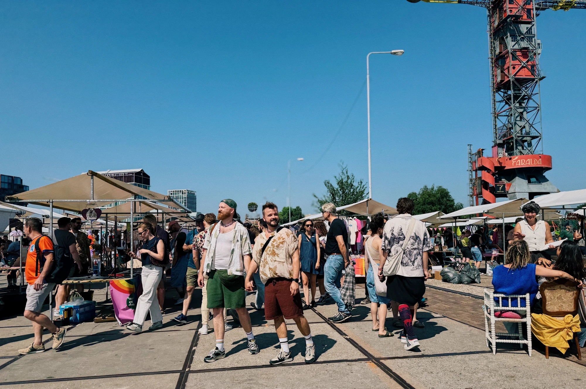 Shopping LGBTQ+ products at Queer Market XXL in Amsterdam Noord - NDSM Werf © Coupleofmen.com