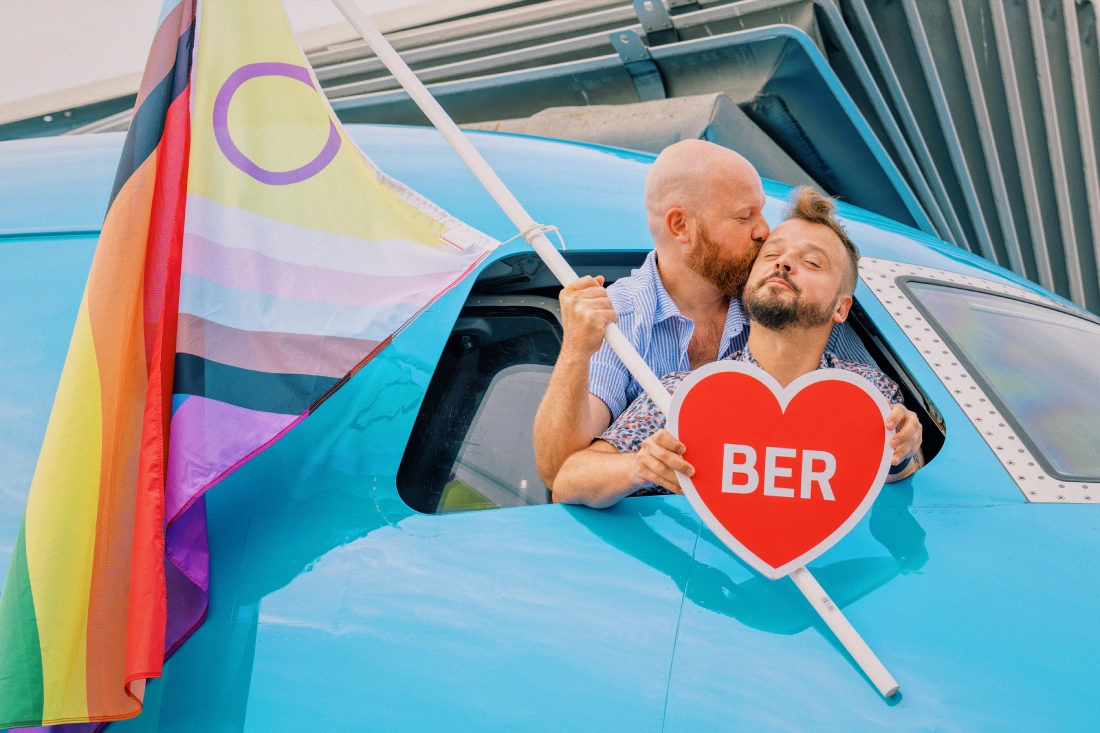 A kiss in the cockpit of KLM Pride Flight from Amsterdam to Berlin