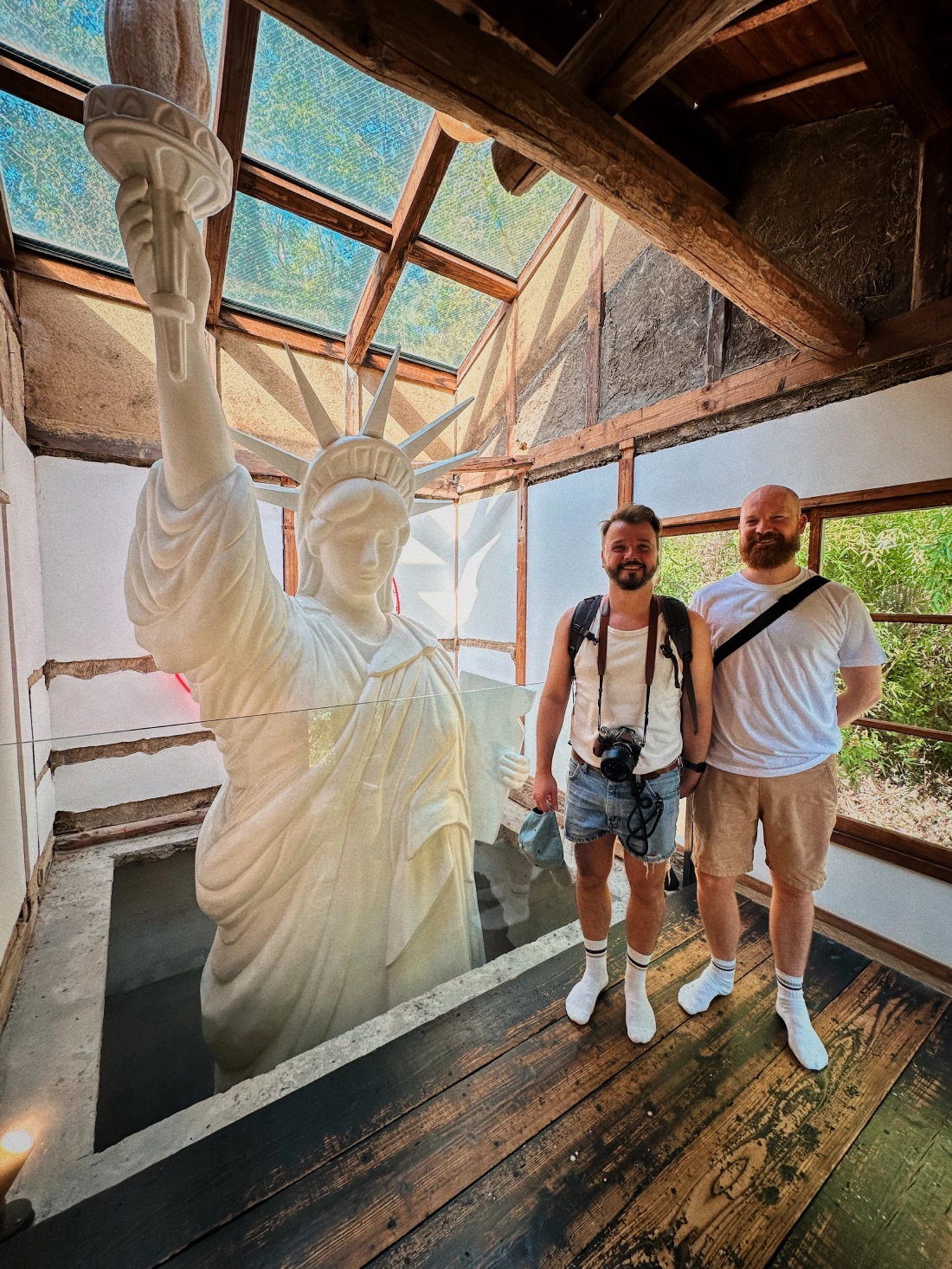 Haisha of the Art House Project with us standing in front of the statue of liberty