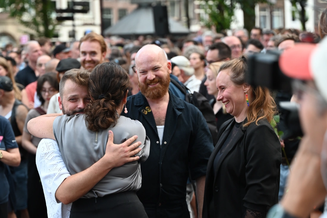 Karl getting a hug from Amsterdam mayor Femke Halsema