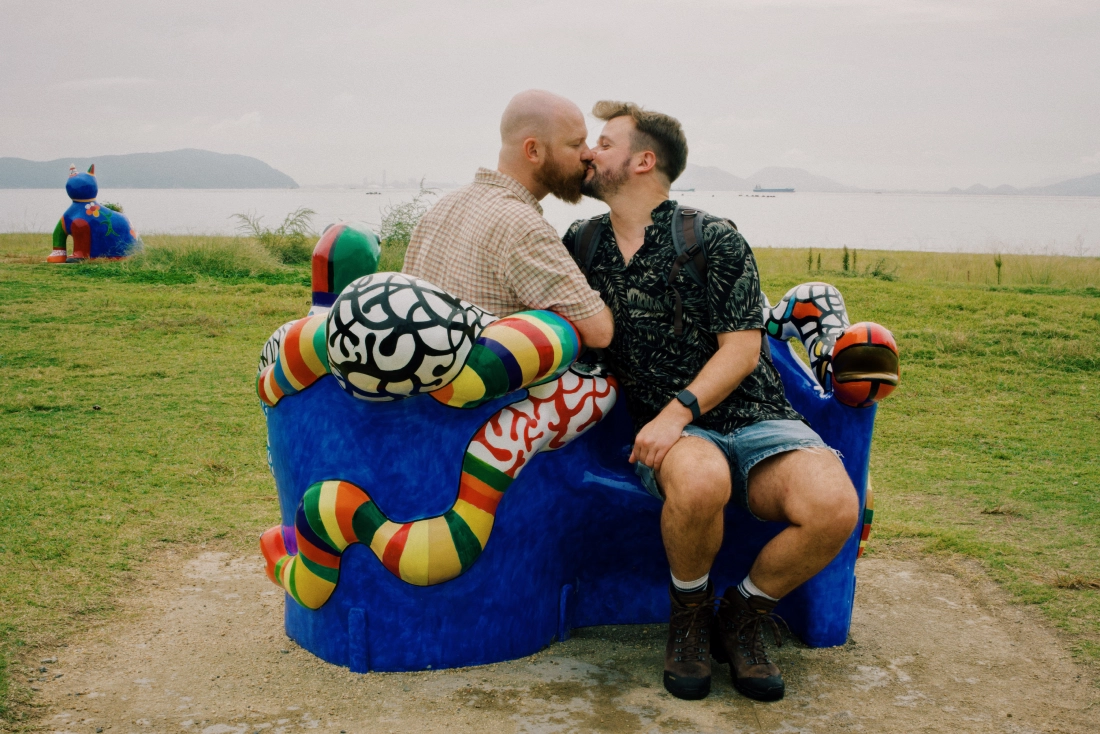 Our kiss sitting on the bench by Niki de Saint Phalle La Conversation from 1989 | Naoshima gay travel guide
