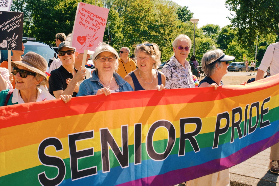 Senior Pride group marching with a banner during WorldPride March Amsterdam 2026