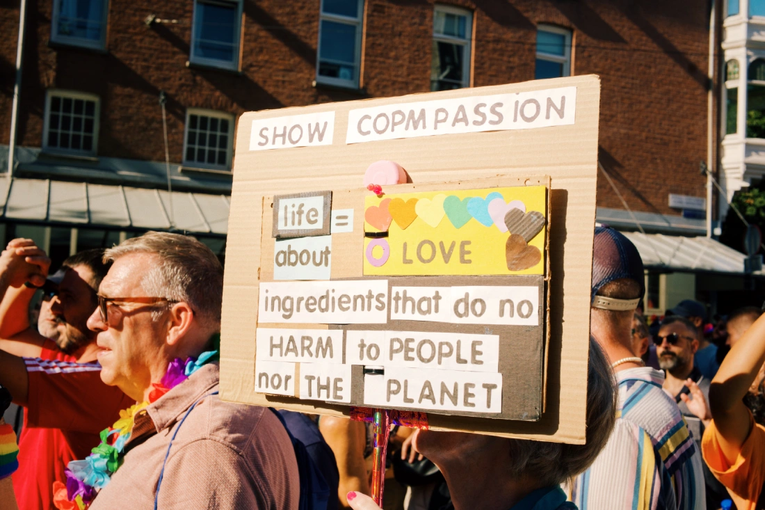 Show Compassion: Life is about Love poster at World Pride March © Coupleofmen.com