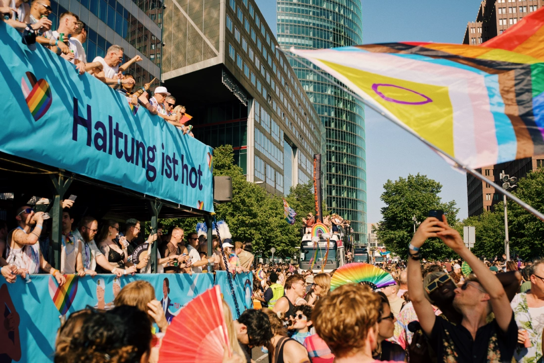 TUI Cruises truck after Potsdamer Platz with big Progress Pride flag