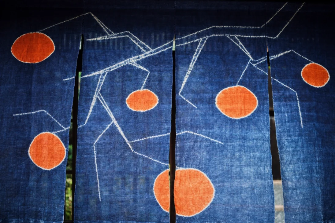 The beautiful blue, white, orange Noren (暖簾) at the entrance of the Ando Museum