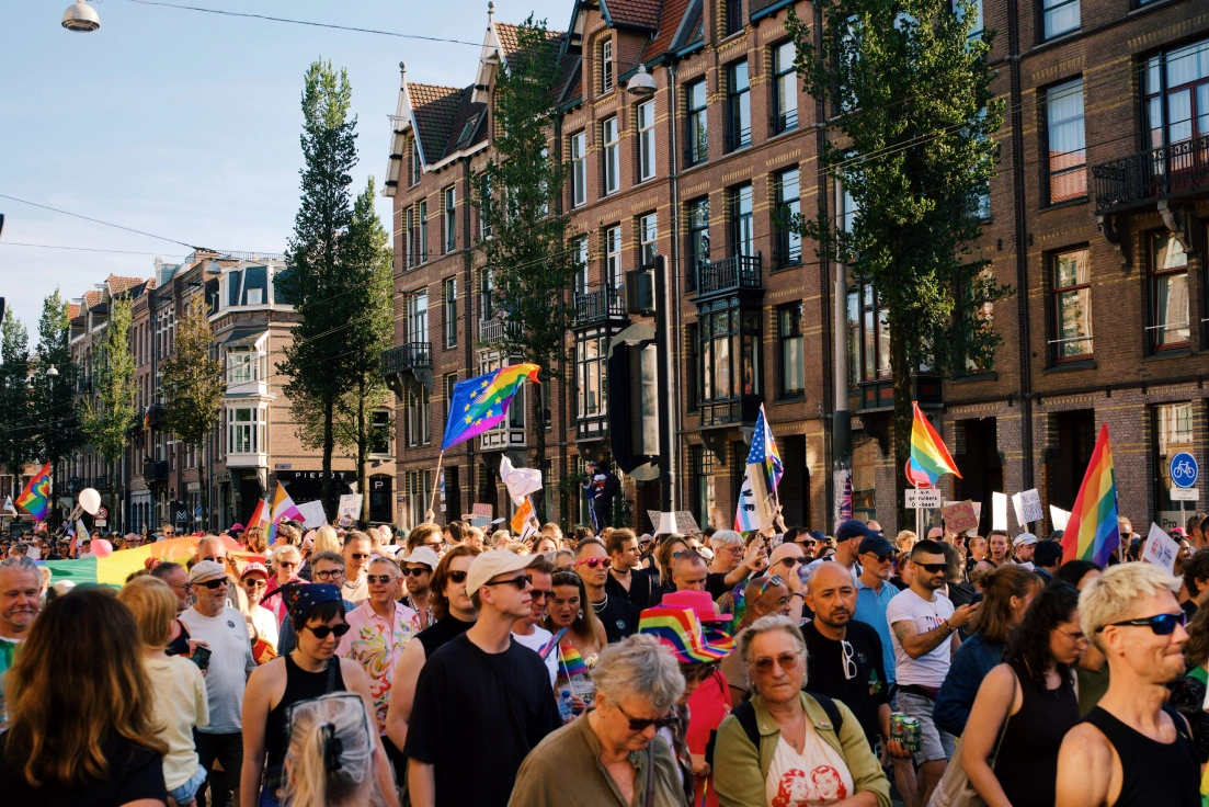 Thousands of demonstrators walking World Pride March 2026 in Amsterdam